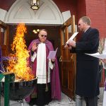 Julie Lewis | The Daily Star
The Rev. John P. Rosson Pastor of Saint Mary's Our Lady of the Lake Catholic Church in Cooperstown leads a non-ecumenical service of burning of the palms on the front steps of the church on Chestnut Street. At left is the Rev. Mark Michael of Christ Episcopal Church in Cooperstown, from right is the Rev. Betsy Jay, Bassett Hospital Chaplain, and Peter Deysenroth, First Presbyterian Church of Cooperstown organist.